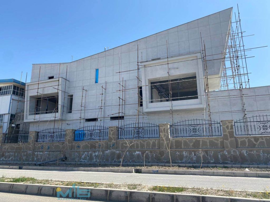 ساختمان اداری شرکت آمیژاد اجرای نمای ساختمان سیمان شسته در تهران